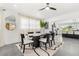Bright dining room with modern table, chairs, and decor, flowing into an open-concept kitchen for easy entertaining at 380 Colony Point S Rd, St Petersburg, FL 33705