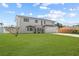 Beautiful two-story home with a well-maintained lawn, a modern exterior, and a private driveway at 380 Colony Point S Rd, St Petersburg, FL 33705