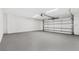 Spacious and clean two car garage with an automatic door, offering ample parking and storage space at 380 Colony Point S Rd, St Petersburg, FL 33705