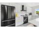 Well-equipped kitchen with modern appliances, ample counter space, and sleek cabinetry, designed for culinary enthusiasts at 380 Colony Point S Rd, St Petersburg, FL 33705