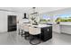 Stylish kitchen with a large island, modern appliances, and a window view, perfect for cooking and entertaining at 380 Colony Point S Rd, St Petersburg, FL 33705