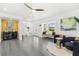 Bright and open living room featuring stylish furniture and ample natural light at 380 Colony Point S Rd, St Petersburg, FL 33705