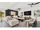 This spacious living room features modern decor, sleek ceiling fans, and is a perfect space for entertaining and relaxation at 380 Colony Point S Rd, St Petersburg, FL 33705