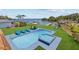 A beautiful pool and spa overlook waterfront views, complete with an outdoor lounge area and lush landscaping at 380 Colony Point S Rd, St Petersburg, FL 33705