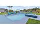 Beautiful backyard pool with lounge chairs and landscaping with a view of the waterfront at 380 Colony Point S Rd, St Petersburg, FL 33705