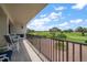 Spacious condo balcony offering expansive views of the golf course and landscaping at 4 Belleview Blvd # 305, Belleair, FL 33756