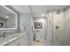 Stylish bathroom with marble countertops, sleek vanity, frameless glass shower and neutral color palette at 4 Belleview Blvd # 305, Belleair, FL 33756