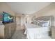 Serene bedroom featuring neutral tones, plush bedding, and convenient access to ensuite bathroom at 4 Belleview Blvd # 305, Belleair, FL 33756