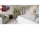 Comfortable bedroom with neutral decor, dresser, and easy access to a private ensuite bathroom at 4 Belleview Blvd # 305, Belleair, FL 33756