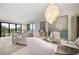 Dining area with large windows, elegant furnishings, and chandelier lighting at 4 Belleview Blvd # 305, Belleair, FL 33756