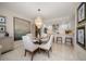Elegant dining room featuring a glass table and chandelier with modern finishes at 4 Belleview Blvd # 305, Belleair, FL 33756