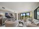 Cozy living room with golf course views and a large entertainment center at 4 Belleview Blvd # 305, Belleair, FL 33756