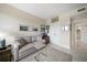 Neutral living room with comfortable seating and art, leading to hallway and bedrooms at 4 Belleview Blvd # 305, Belleair, FL 33756