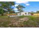 Backyard with a pool and new fence, ready for entertaining and relaxation at 4020 N Falkenburg Rd, Tampa, FL 33610