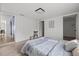 Neutral bedroom with wood-look floors, with doorway views into the living area and ensuite bathroom at 4020 N Falkenburg Rd, Tampa, FL 33610