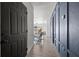 Hallway boasts wood-look tile, dark wainscoting and doors leading to living areas at 4020 N Falkenburg Rd, Tampa, FL 33610