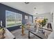 Bright living room with modern decor, neutral furniture, and large windows offering outdoor views at 4020 N Falkenburg Rd, Tampa, FL 33610