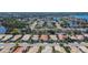 Wide aerial view of a neighborhood featuring lakes, green spaces, and well-maintained homes in Florida at 4415 Muirfiled Dr, Bradenton, FL 34210