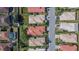 Overhead perspective of a residential area, highlighting the community's layout with diverse homes and waterways at 4415 Muirfiled Dr, Bradenton, FL 34210