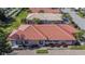 An aerial view of the home featuring a red tile roof, neat landscaping, and an attached two-car garage at 4415 Muirfiled Dr, Bradenton, FL 34210