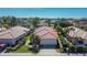 Beautiful aerial view of home with a red tile roof, lush landscaping, and a well-manicured lawn at 4415 Muirfiled Dr, Bradenton, FL 34210