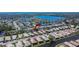 Drone photo of community near lake and ocean, showing homes and manicured landscape at 4415 Muirfiled Dr, Bradenton, FL 34210