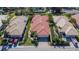 Birds eye view of house with red tile roof in community showing landscaping at 4415 Muirfiled Dr, Bradenton, FL 34210