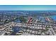 Wide aerial panorama displays a community with homes, lakes, and green spaces stretching to the horizon at 4415 Muirfiled Dr, Bradenton, FL 34210