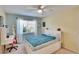 Cozy bedroom with a desk, bright window, and comfortable bed, creating a functional and inviting space at 4415 Muirfiled Dr, Bradenton, FL 34210