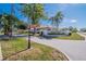 Welcoming entrance to Highland Lakes featuring lush landscaping and signage in a serene setting at 4415 Muirfiled Dr, Bradenton, FL 34210