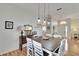 Dining room featuring hardwood floors, modern decor, and access to other living areas at 4415 Muirfiled Dr, Bradenton, FL 34210