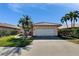 Well-maintained single-Gathering home with a red tile roof, neat landscaping, and attached two-car garage at 4415 Muirfiled Dr, Bradenton, FL 34210