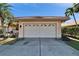Close-up view of a home's garage door, showcasing its design and curb appeal in a sunny setting at 4415 Muirfiled Dr, Bradenton, FL 34210