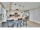 Open kitchen with a breakfast bar, granite countertops, stainless steel appliances, and ample storage space at 4415 Muirfiled Dr, Bradenton, FL 34210