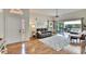 Inviting living room featuring neutral walls, hardwood floors, modern decor, and large sliding glass doors at 4415 Muirfiled Dr, Bradenton, FL 34210