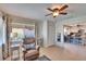 Comfortable living room featuring a recliner, ceiling fan, and natural light, creating a cozy and inviting space at 4415 Muirfiled Dr, Bradenton, FL 34210