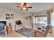 Cozy living room with a comfortable recliner, a ceiling fan, and a window with bright natural light at 4415 Muirfiled Dr, Bradenton, FL 34210