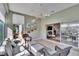 Inviting sunroom with tile floors, ceiling fan, and sliding glass doors that open to the main living area at 4415 Muirfiled Dr, Bradenton, FL 34210