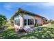 Exterior view of the sunroom addition, highlighting its windows and access to the backyard at 4415 Muirfiled Dr, Bradenton, FL 34210