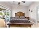 Primary bedroom features a vaulted ceiling, and sliding glass doors to the lanai at 4511 Preston Woods Dr, Valrico, FL 33596