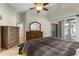 Bright primary bedroom features a sliding glass door to a screened outdoor living space at 4511 Preston Woods Dr, Valrico, FL 33596
