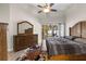 This cozy bedroom features vaulted ceilings and access to a screened lanai at 4511 Preston Woods Dr, Valrico, FL 33596