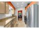 Well-appointed kitchen showcases stainless steel appliances, ample counter space, and view to dining area at 4511 Preston Woods Dr, Valrico, FL 33596