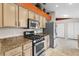 Efficient kitchen featuring stainless steel appliances, granite countertops, and neutral-toned cabinetry at 4511 Preston Woods Dr, Valrico, FL 33596