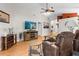 Inviting living room boasts wood flooring, neutral walls, and a decorative ceiling fan at 4511 Preston Woods Dr, Valrico, FL 33596