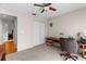 Functional office space featuring a ceiling fan, closet, and wooden desk, ideal for a work-from-home setup at 4511 Preston Woods Dr, Valrico, FL 33596