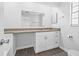Bright bathroom with a spacious vanity, granite counters, updated fixtures, and a tiled shower at 4532 Cedarwood Village Dr, Tampa, FL 33624