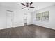 Bedroom with hardwood floors, window, and closet, and bathroom at 4532 Cedarwood Village Dr, Tampa, FL 33624