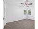 Bright bedroom with gray wood-look floors and a window at 4532 Cedarwood Village Dr, Tampa, FL 33624