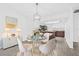 Bright dining room with chandelier lighting, modern decor and open to kitchen at 4532 Cedarwood Village Dr, Tampa, FL 33624
